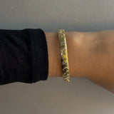 SYMBOL SOLAR CUFF ARMBAND Guld - Stelt ⌀6,5cm